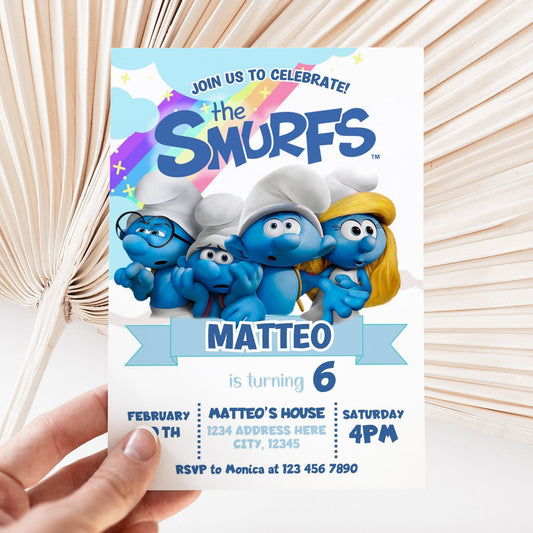 Smurfs birthday invitation held by a hand with a light background